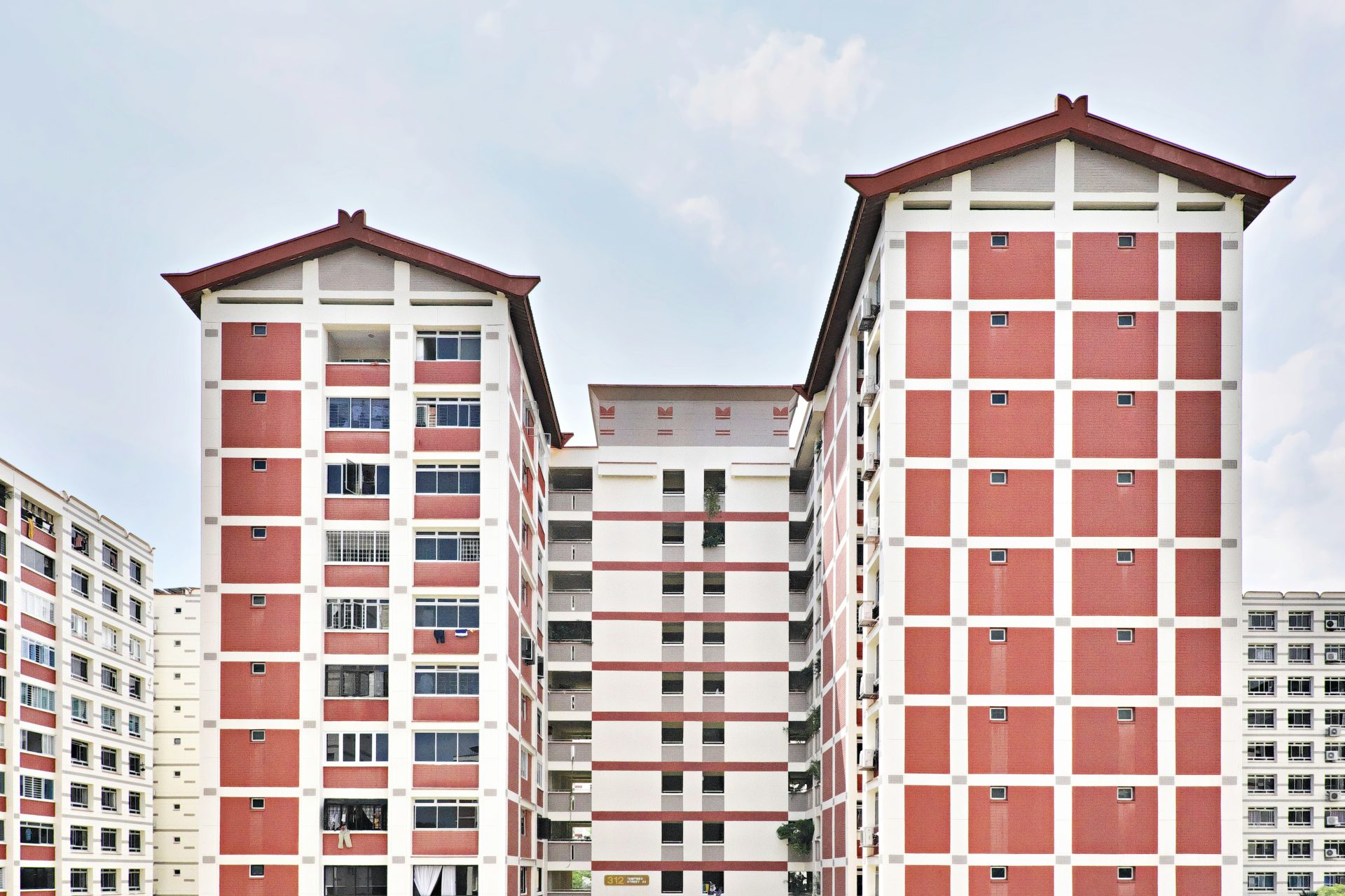 a large red and white building with two stories